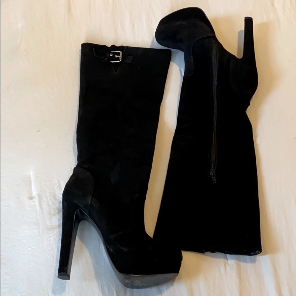 Knee high black heeled boots